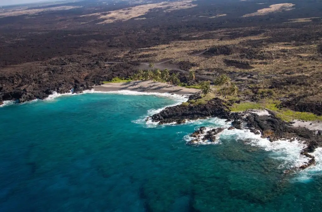 Turquoise Waters Embrace a Rocky Isle