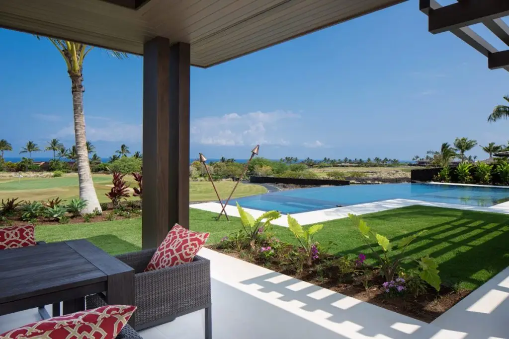 beautiful patio with a pool