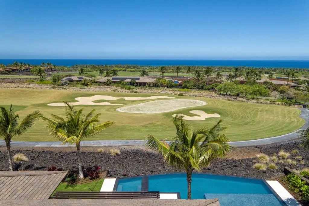 beautiful golf course with a pool