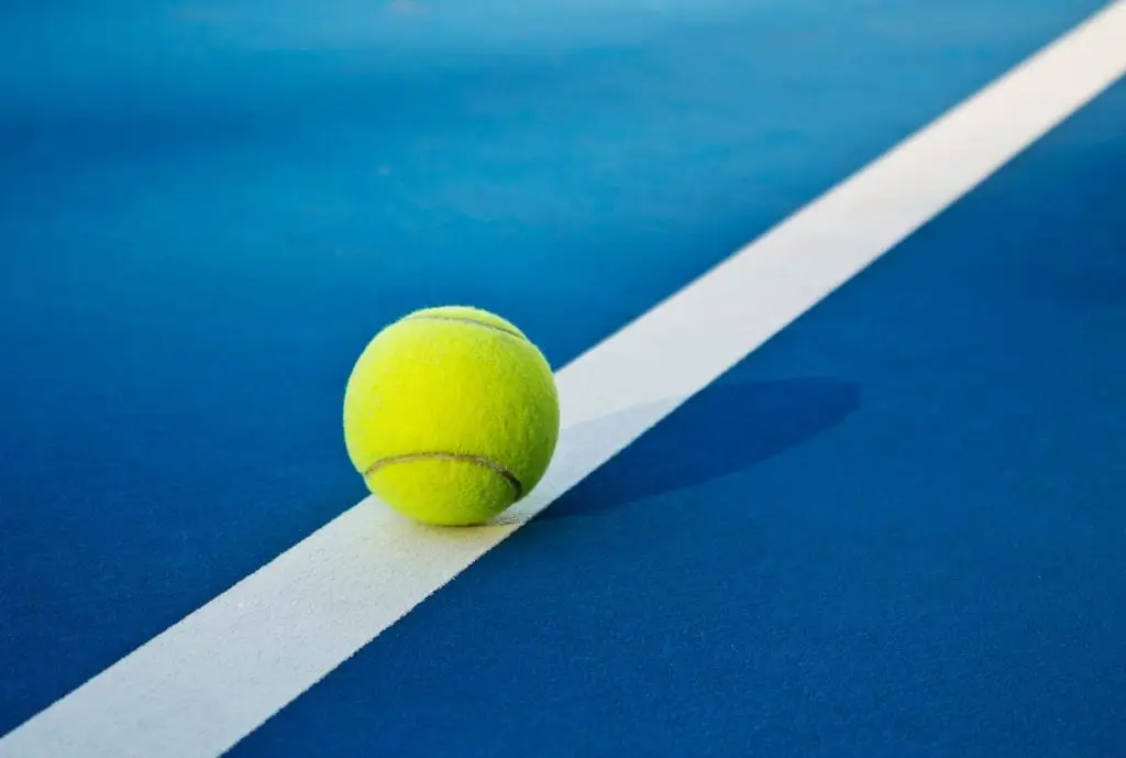 Tennis Ball Touching The Court Line