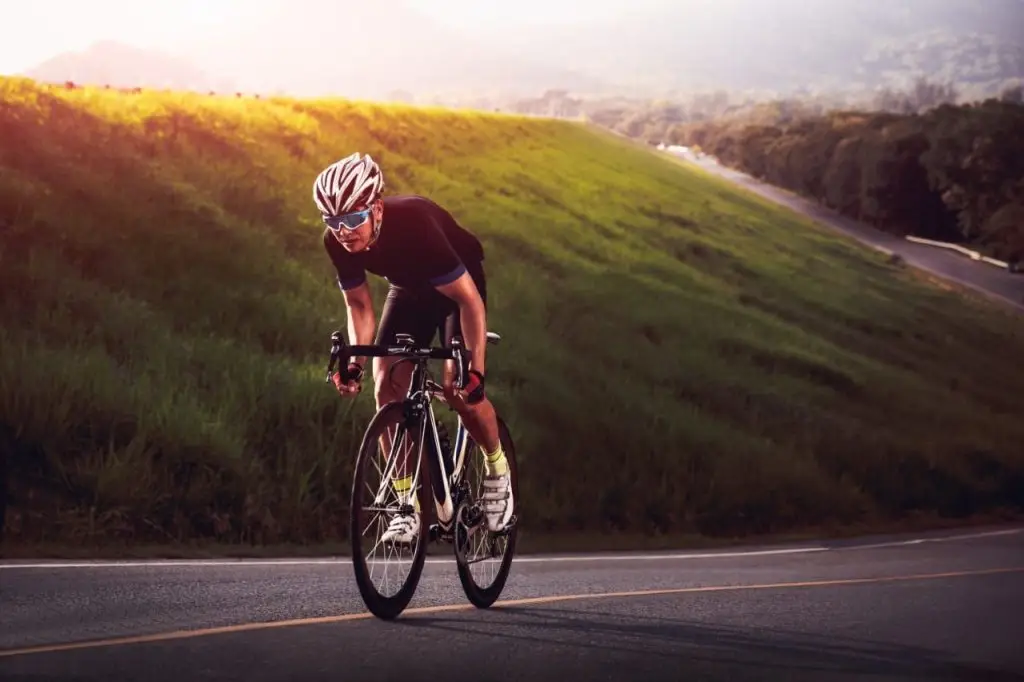 Man Riding His Racer Bike Uphill