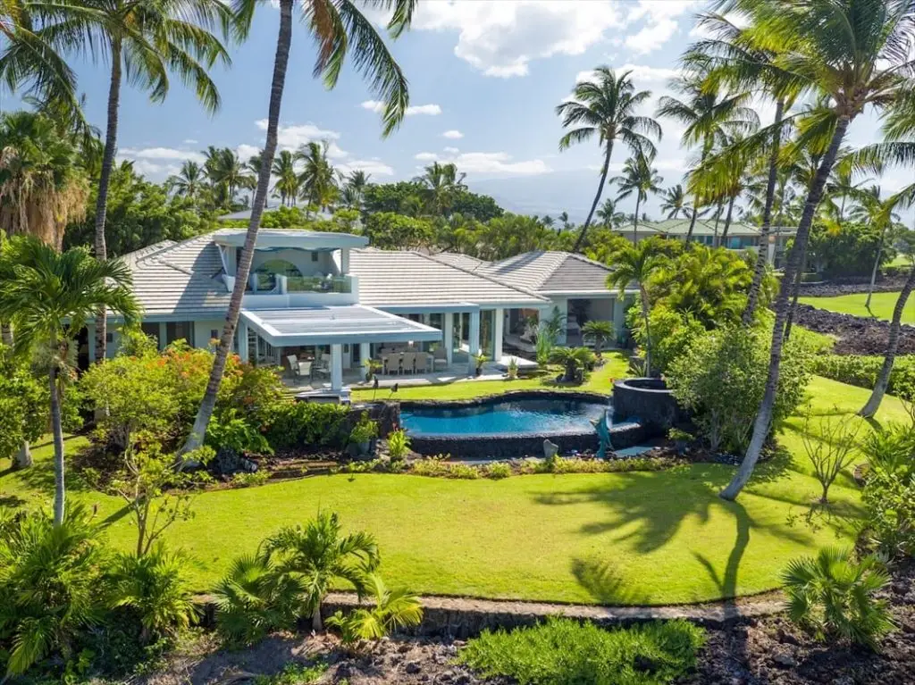 Mansion Resort With A Beautiful Black Stone Pool With Surrounding Coconut Trees