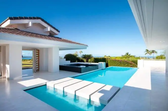 Swimming Pool In An All-White Resort House