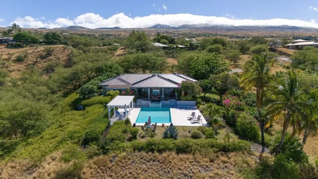 aerial view of Kohala ranch home with pool and sun bathing deck